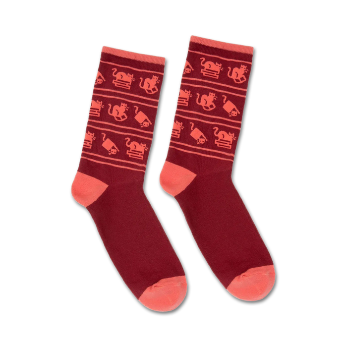 Pair of burgundy crew socks with a playful pattern of coral cats and stacks of books. }}
