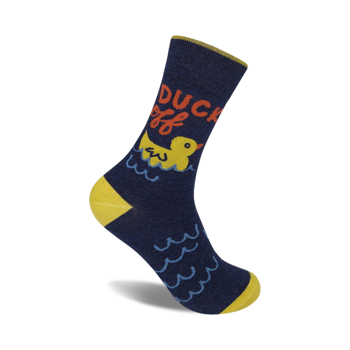 A navy blue crew sock with a yellow heel and toe. Features a yellow rubber duck in water, with the words 'Duck Off!' in red and orange. }}