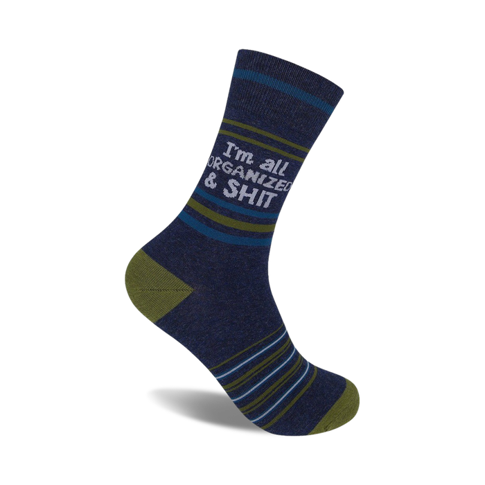A navy blue crew sock with olive and teal stripes features the text 'I'm all organized & shit' in light gray. }}