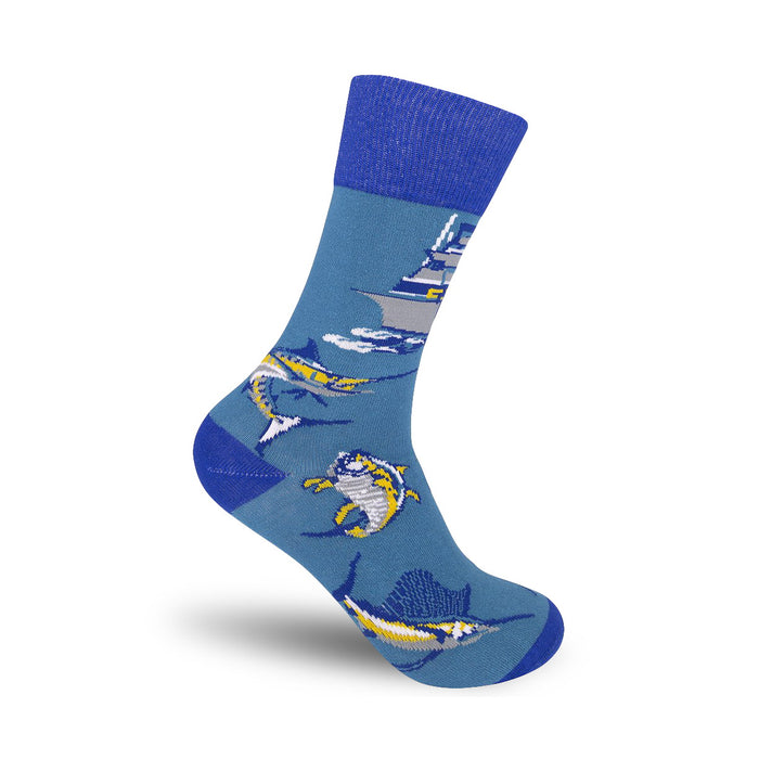 Crew socks in teal blue, featuring colorful marlin, a yacht, and ocean waves. A fun, illustrated design for fishing enthusiasts. }}