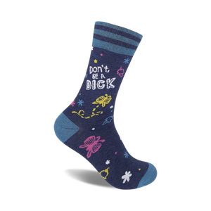A navy blue crew sock with 'Don't Be A Dick' in white text and colorful whimsical designs including flowers and stars.