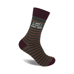 Crew socks in olive green with thin orange stripes and a maroon cuff. The text 'I DON'T ACTUALLY WORK HERE' is printed on the sock.
