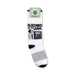 A product shot of 'Teaching Is My Jam' socks on a retail packaging card.