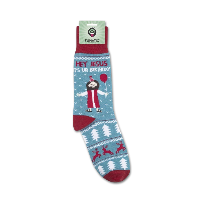 Close-up view of the 'Hey Jesus It's Ur Birthday' socks, showing the detail of the design and the packaging.