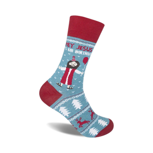 Crew socks in teal and red, featuring a cartoon Jesus with a party hat and balloon, surrounded by Christmas-themed designs.
