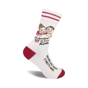 Off-white crew socks with red stripes and a humorous illustration of a couple. Text reads 'We decided NOT to have kids' and 'The kids are taking it pretty hard.'
