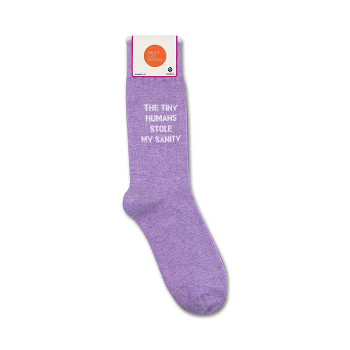 Product shot showing lavender 'The Tiny Humans Stole My Sanity' socks in their packaging.