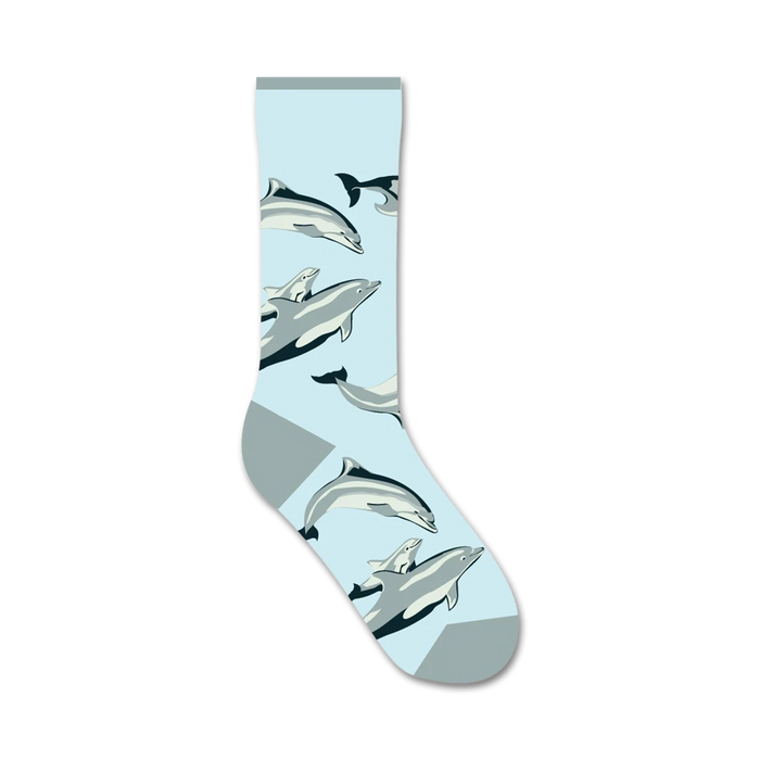 Crew socks in light blue featuring a playful design of gray and white dolphins swimming.  }}