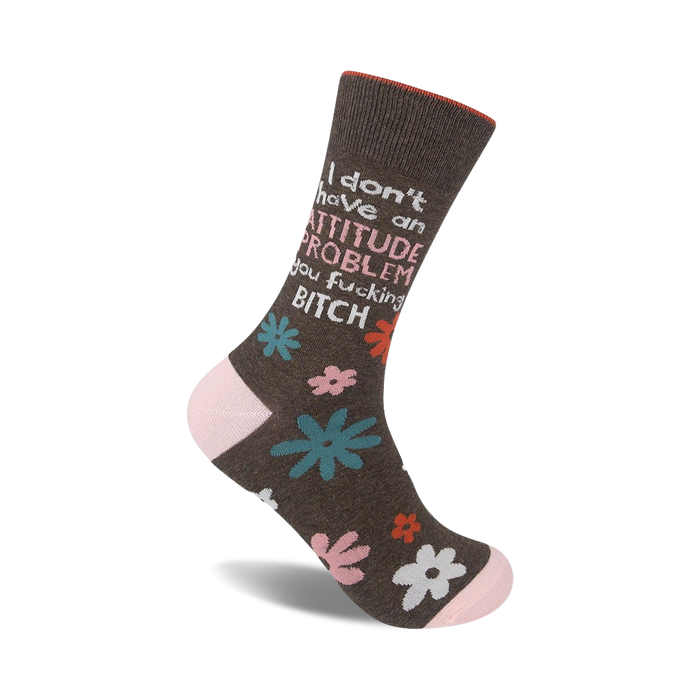 Brown crew socks with a pink cuff, featuring a sassy message and teal, pink, and white floral accents.