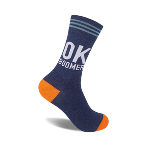 A navy blue crew sock with orange heel and toe. White 'OK BOOMER' text is prominently displayed.