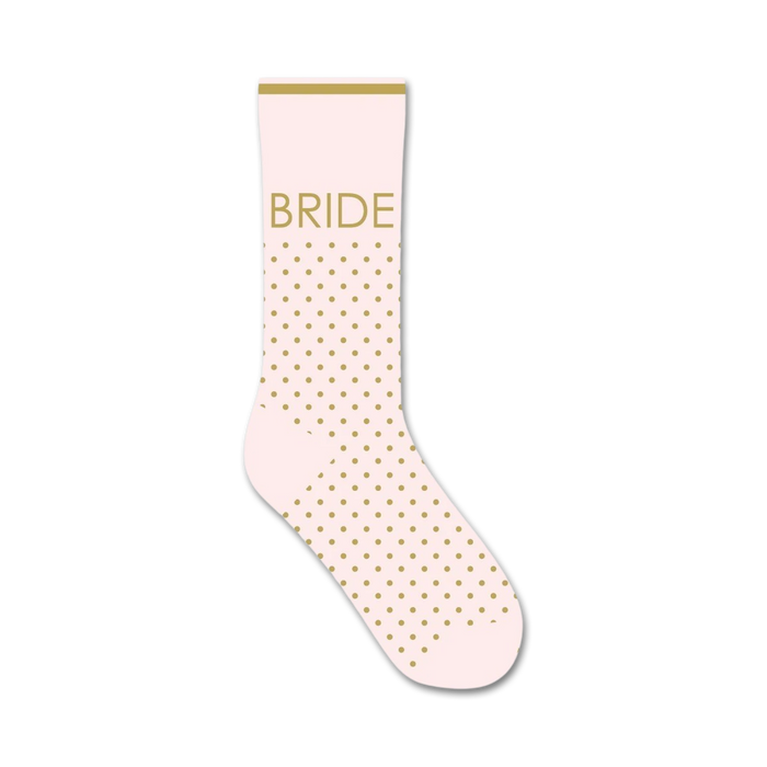 A single blush pink crew sock with gold polka dots and the word 'BRIDE' in gold lettering displayed on the leg. }}