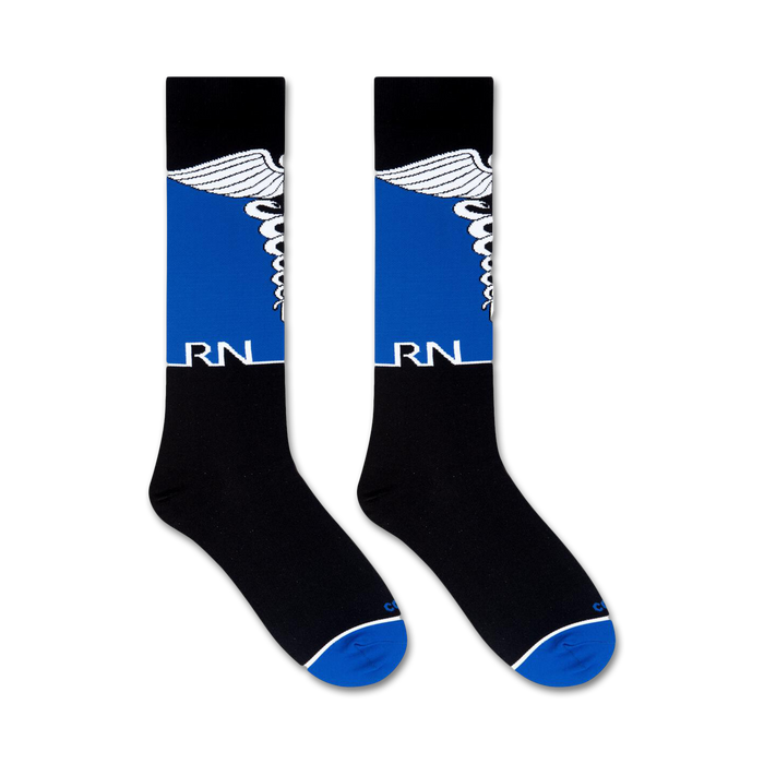 A pair of black socks with blue and white details. The word 