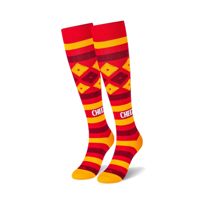 Pair of red and gold knee-high socks with a Cheez-It-inspired design. Features horizontal stripes and diamond patterns.