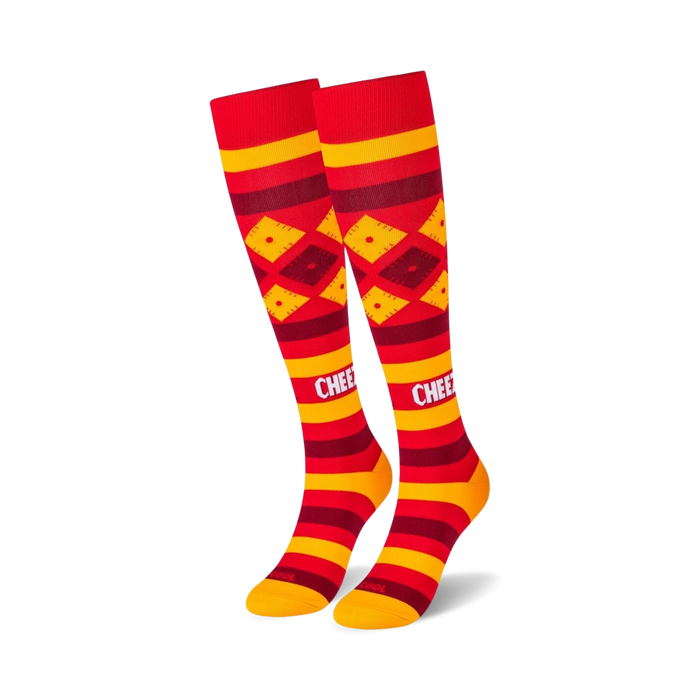 red and yellow knee-high socks with a repeating pattern of diamonds and stripes. great for men and women.   