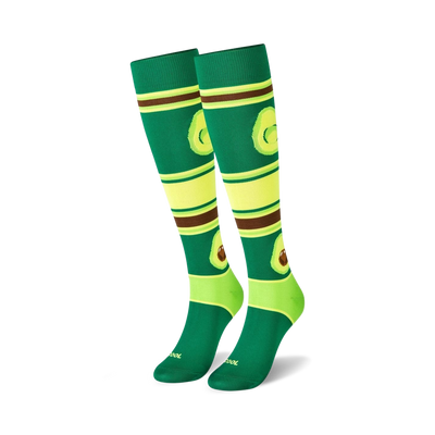 Pair of knee-high socks with avocados and stripes in green, lime, and brown. Fun and quirky design.