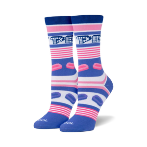 Pair of crew socks in blue, pink, and white.  Features horizontal stripes, Pez dispenser logo, and pink Pez candy graphics.