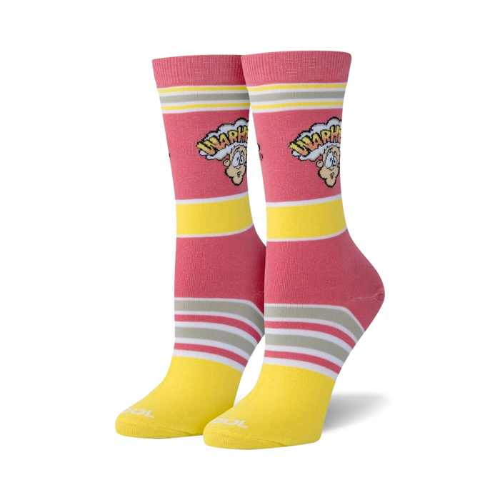 Pair of women's crew socks in pink and yellow stripes. The socks feature a retro Warheads logo with cartoon character.