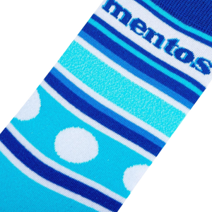 Close-up detail shot of the Mentos Stripes sock fabric, highlighting the stripes, polka dots, and Mentos logo.