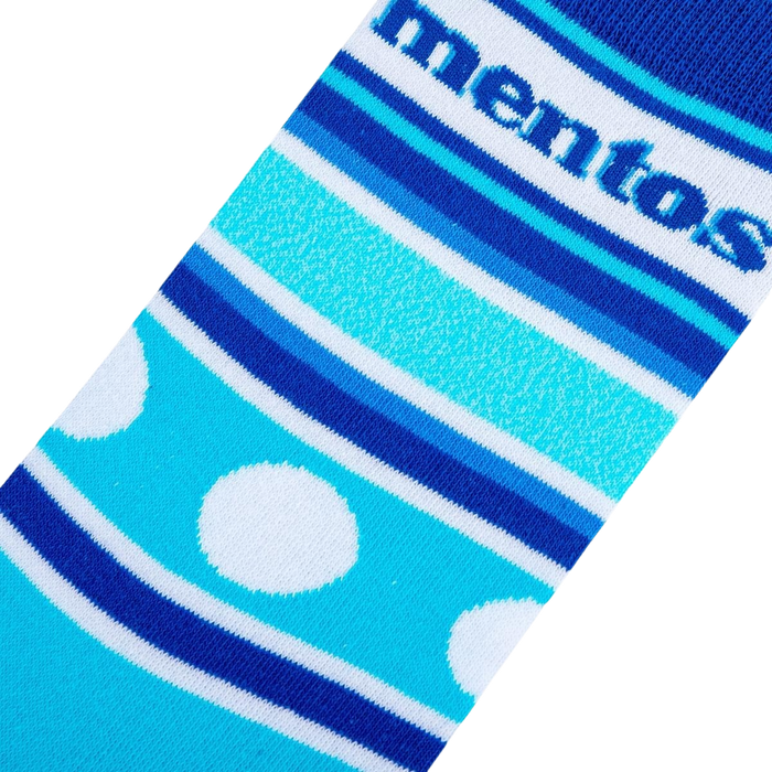 Close-up detail shot of the Mentos Stripes sock fabric, highlighting the stripes, polka dots, and Mentos logo.