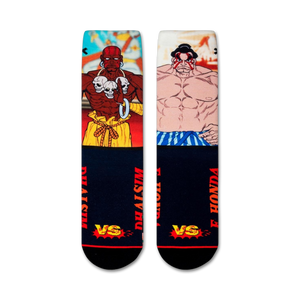 Flatlay showcasing a pair of Street Fighter Dhalsim vs E. Honda crew socks.