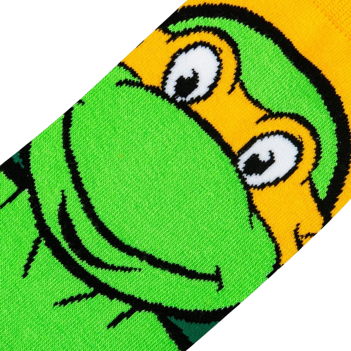 Close-up detail shot showcasing the texture and colors of Michelangelo's face on the TMNT socks.