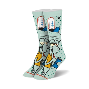 Crew socks in teal featuring Squidward Tentacles from Spongebob Squarepants. He's depicted holding a notebook, wearing his signature hat, on a teal background with white polka dots.