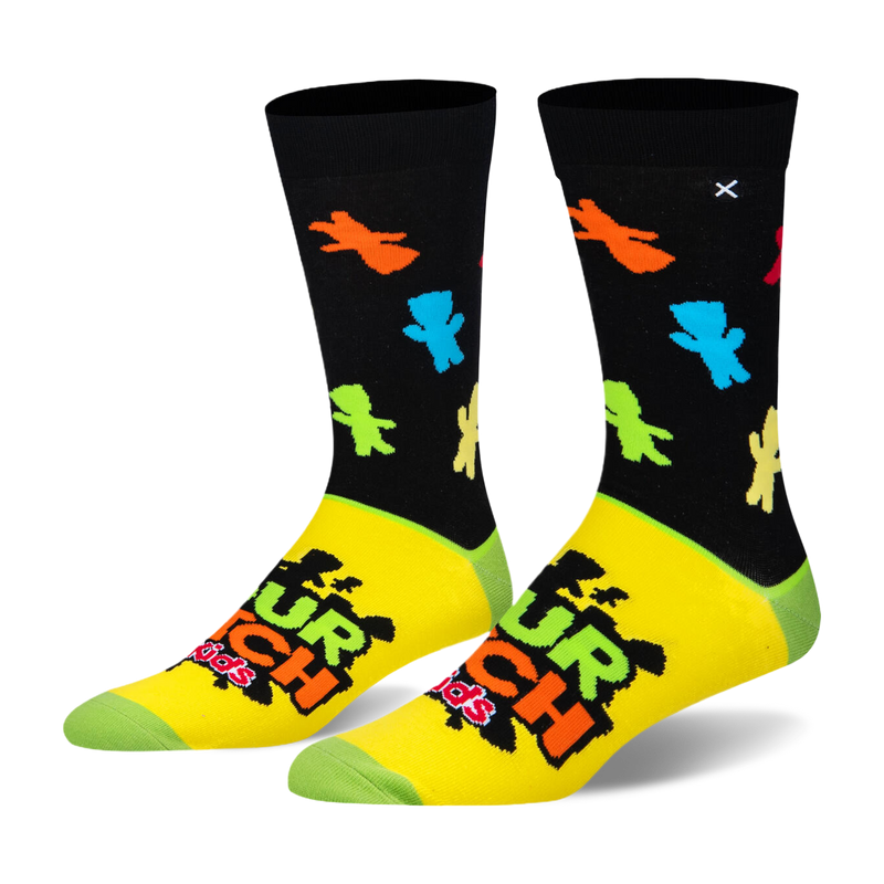 Crew socks with a black top featuring neon candy silhouettes, a yellow foot with the Sour Patch Kids logo, and green toes.