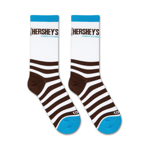 A pair of brown and white striped socks with the word 
