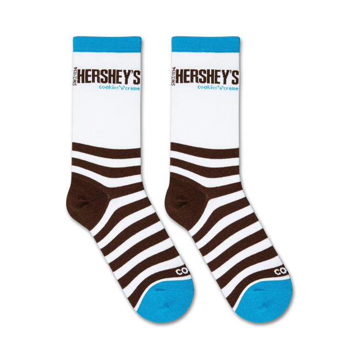 A pair of brown and white striped socks with the word 