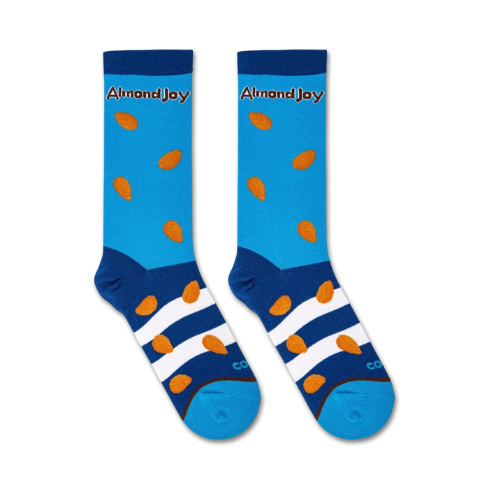 A pair of blue socks with a pattern of brown almond nuts. The socks have white stripes at the ankle and a blue toe and heel. The word 