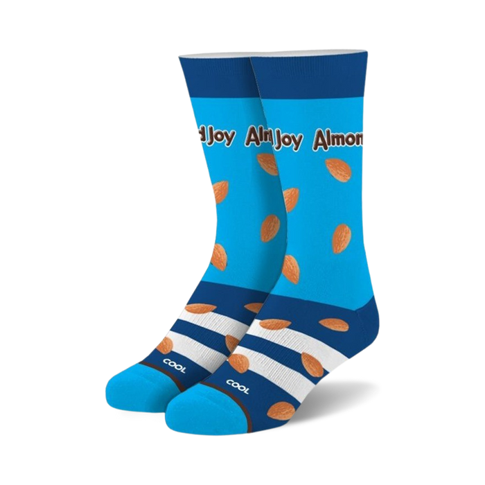 A pair of crew socks in bright blue with scattered almond images and a chocolate-striped cuff. The text 'Almond Joy' is visible.