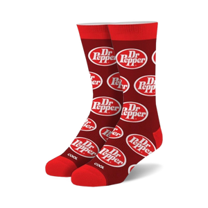 Pair of crew socks in red with a repeating white Dr Pepper logo pattern.  A 'COOL' tag is visible at the bottom.