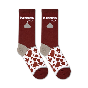 A pair of red crew socks with the word 