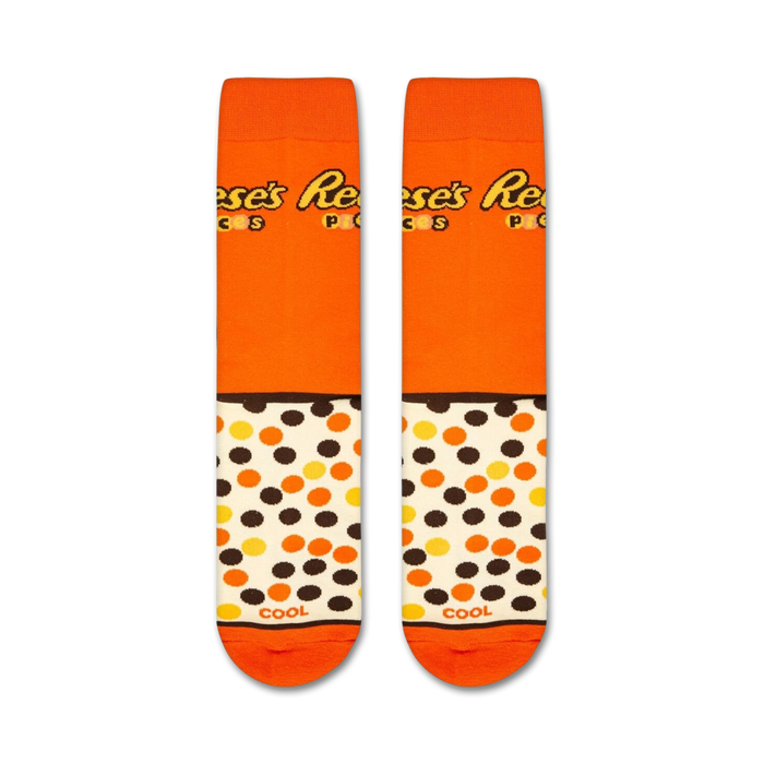 Flatlay product shot of two Reese's Pieces socks showcasing the full design.