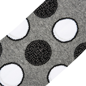 Close-up detail shot highlighting the Oreo cookie pattern on the socks.