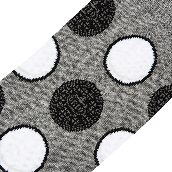 Close-up detail shot highlighting the Oreo cookie pattern on the socks.