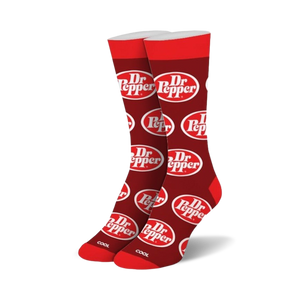Pair of red crew socks with a repeating Dr Pepper logo pattern. White logo on red background.