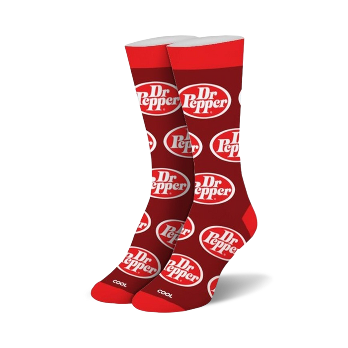 Pair of red crew socks with a repeating Dr Pepper logo pattern. White logo on red background.