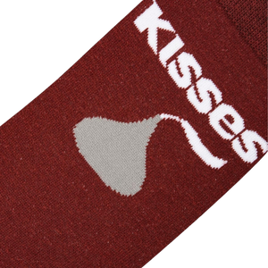 A brown sock with a white Hershey's Kisses logo.