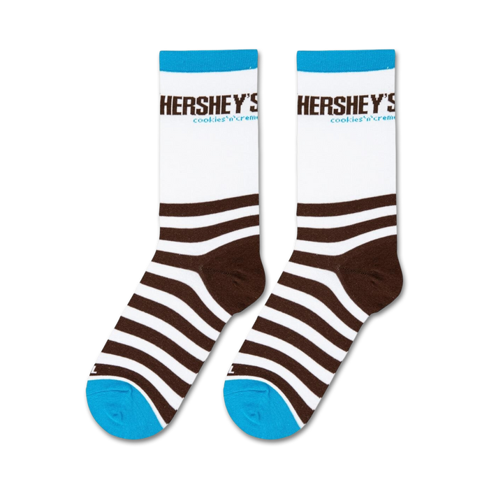 A pair of white socks with brown stripes and the words 
