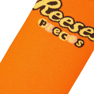 An orange sock with the word 