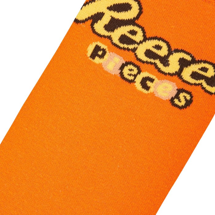 Close-up detail shot of the Reese's Pieces logo on the socks.