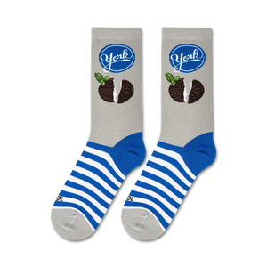 Flatlay showcasing a pair of York Peppermint Pattie socks, highlighting the design and blue and white stripes.