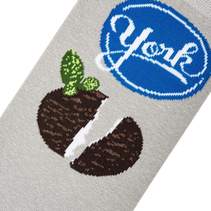 Close-up detail shot of the York Peppermint Pattie design on a grey sock, showing the texture and print quality.
