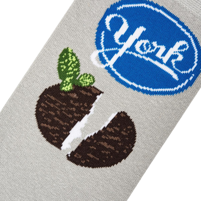 A gray sock with a brown and white York Peppermint Pattie graphic and a blue oval with white outline and the word 