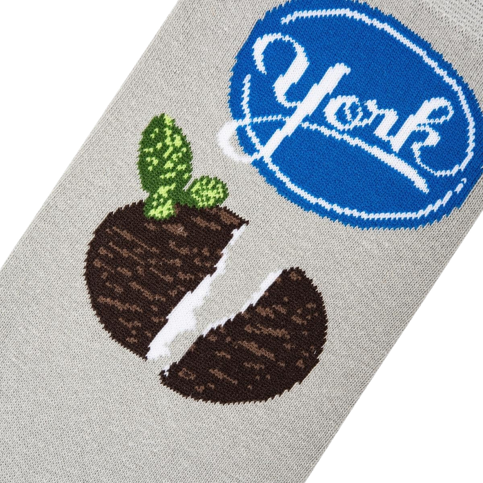 Close-up detail shot of the York Peppermint Pattie design on a grey sock, showing the texture and print quality.