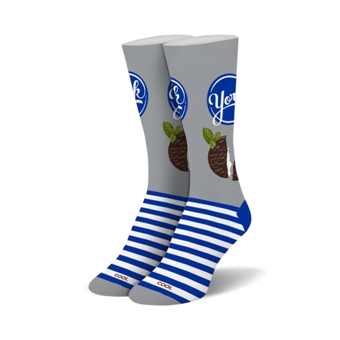 Pair of crew socks in grey and blue.  The socks feature a York Peppermint Pattie design with the brand logo and a peppermint pattie graphic.