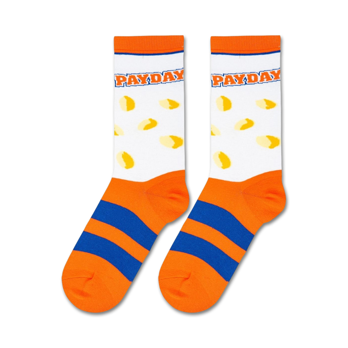 A pair of white socks with an orange top and blue striped bottom. The word 