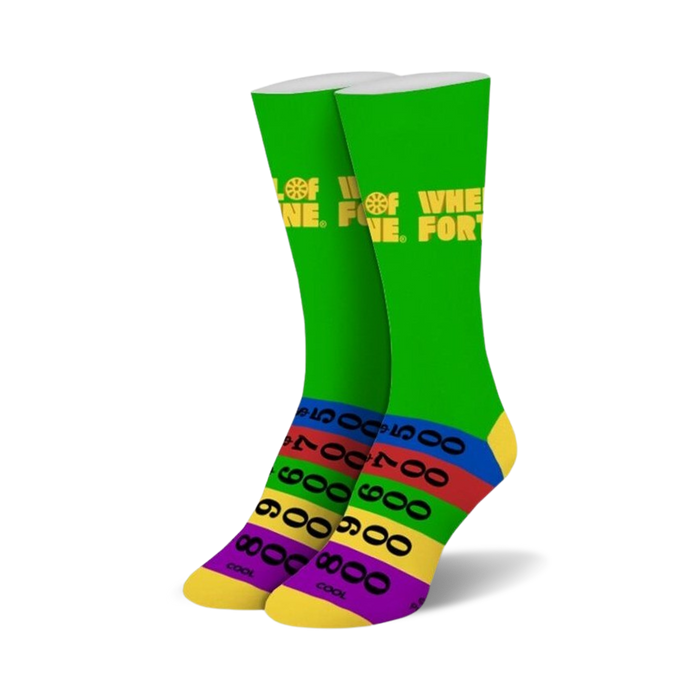 Pair of crew socks in green with the Wheel of Fortune logo and colorful stripes at the bottom, reminiscent of the game's score board.