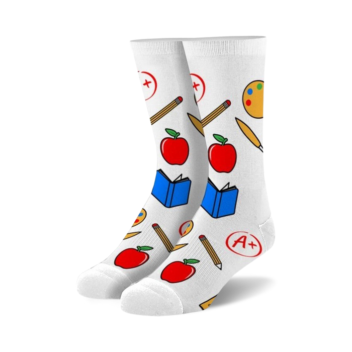 Pair of white crew socks with colorful illustrations of apples, pencils, paint palettes, and books.  Perfect for teachers!